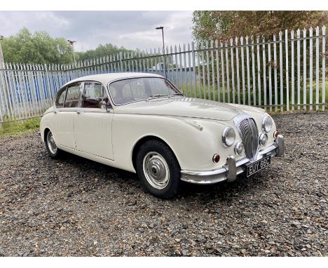 Finished in the popular combo of old English white with red leather interior. A rare manual big bumper car. Sold with a folde