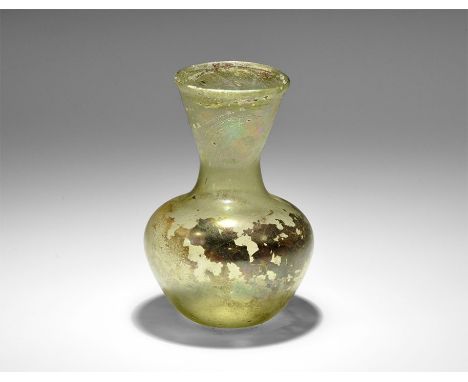 4th century AD. A piriform green glass bottle with broad funicular neck. 53 grams, 11.5cm (4 1/2"). Property of a retired scu