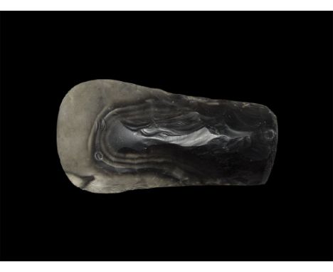 Neolithic, 4th-2nd millenium BC. A large bifacial core cleaver of heavy regular form with convex cutting edge and squared but
