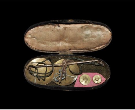 18th-19th century AD. A cased set of scales to check the weights of the English gold guinea and half guinea coins, with steel
