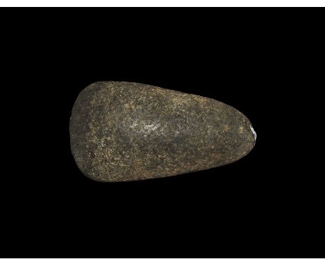 Lower Neolithic, 5th millennium BC. A knapped and polished epidiorite axehead. 176 grams, 87mm (3 1/2"). Ex Dr M. G. Weller c