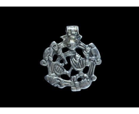 10th-11th century AD. A silver-gilt pendant with Borre-style beast and integral suspension loop; the openwork plaque with thr