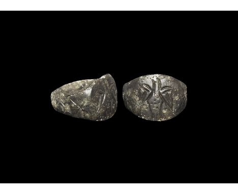 10th-11th century AD. An 'Anlaf Guthfrithsson' type bronze ring with broad flat-section hoop with foliage to the shoulders, d
