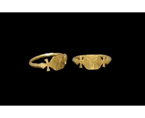 19th century AD. A narrow carinated gold hoop with cruciform shoulders, hexagonal plaque with incised christogram between rin