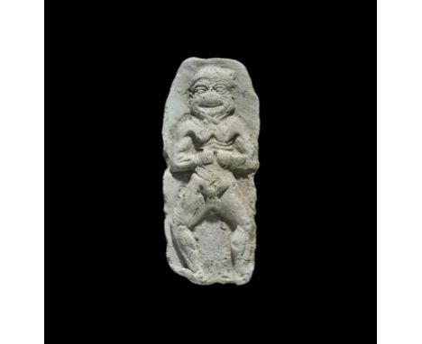 20th-17th century BC. A terracotta plaque with high-relief image of Humbaba, facing with hands to the abdomen, legs spread. 4