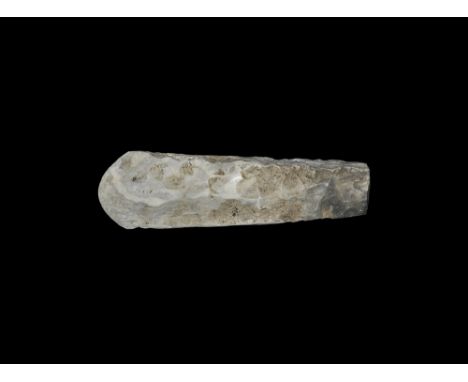 Neolithic, 5th-3rd millenium BC. A substantial knapped axe of rectangular section, the slightly asymmetric convex cutting edg