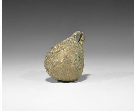 Late 13th-early 14th century AD. A lead-filled bronze steelyard weight with integral loop, two circumferential incised rings 