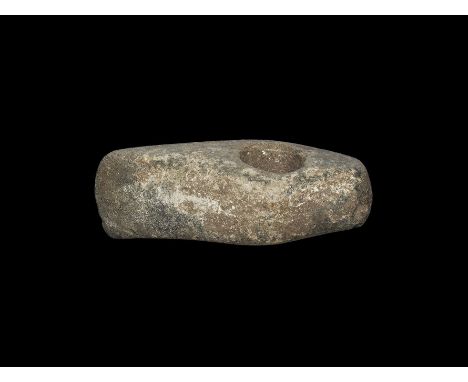 Neolithic, 5th-3rd millennium BC. A small, finely pecked and polished axe, the butt squared, with asymmetric slightly convex 