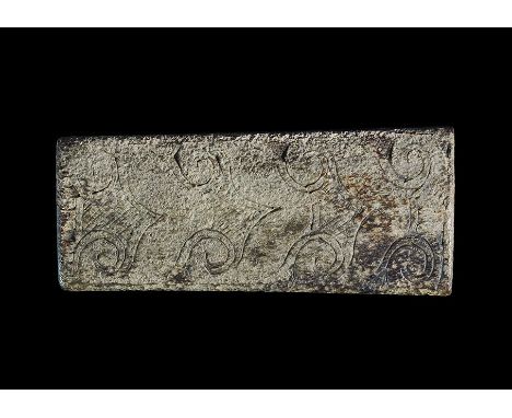 9th-11th century AD. A D-section bone rectangular plaque with incised volute scroll pattern. 12 grams, 62mm (2 1/2"). Propert