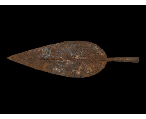 2nd-1st century BC. An iron leaf-shaped La Tène II spearhead with median rib developing to a long, tapering closed socket wit
