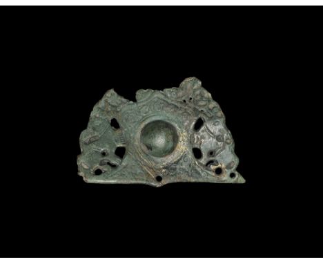 11th-12th century AD. A large openwork bronze mount with central doomed pellet surrounded by a foliage decoration; on both si