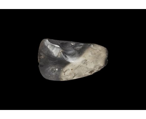 Neolithic, 4th-3rd millennium BC. A bifacial finely knapped axe of asymmetric form, for hafting, the sides blunted by polishi