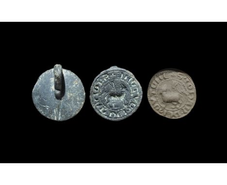 13th-14th century AD. A discoid seal matrix with strap and loop to the reverse; intaglio design of an Agnus Dei and Lombardic