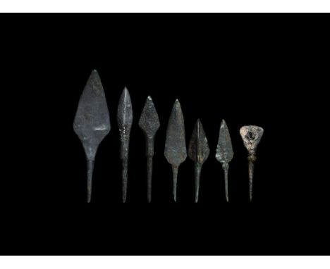 12th-15th century AD. A mixed group of iron tanged arrowheads comprising: one with three blades; one chisel-bladed; one leaf-