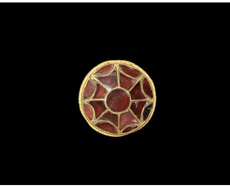 5th-early 6th century AD. A gold discoid plaque with applied loop to the reverse, beaded wire border enclosing octagonal cell