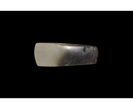Neolithic, 5th-3rd millennium BC. A very finely formed axe with tapered squared sides and butt and asymmetric convex polished