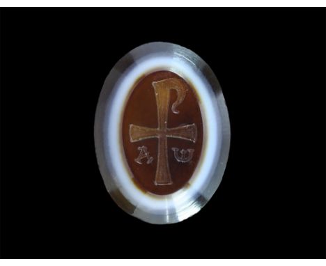 18th-19th century AD. A Byzantine style agate banded intaglio with engraved equal armed cross in the form of a Chi-Rho; alpha