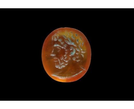 211-218 AD. A carnelian intaglio engraved with a bust of the emperor Caracalla wearing laurel wreath. 0.26 grams, 9mm (1/4").