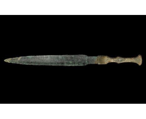 10th century BC. A Bronze Age dirk or dagger with lozenge-section narrow blade, flat-section guard, grip with flanged edges t