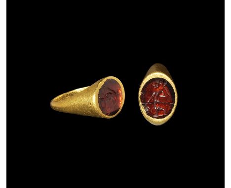 2nd-3rd century AD. A D-section hoop and discoid plaque with inset garnet(?) cloison, intaglio figure of Mars standing helmet