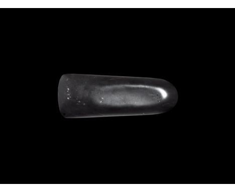 Neolithic, 6th-2nd millennium BC. A polished obsidian axe, lentoid in section with rounded butt. 80 grams, 10cm (4"). Propert