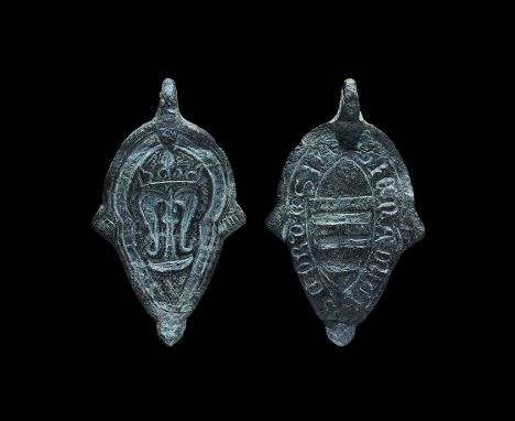 13th-14th century AD. A bronze teardrop pendant with pierced lug above, two lateral fins and lobe finial; one face with low-r