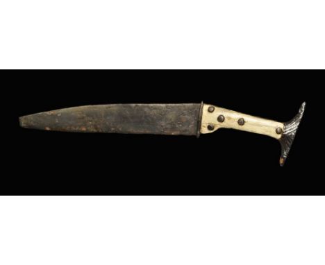 3rd-5th century AD. A single-edged knife with integral guard, grip and pommel; the grip with two applied bone plates held wit