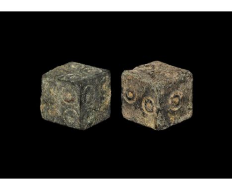 1st-3rd century AD. A pair of dice, one with four ring-and-dot motifs to each face. 29 grams total, 12mm each (1/2"). Private