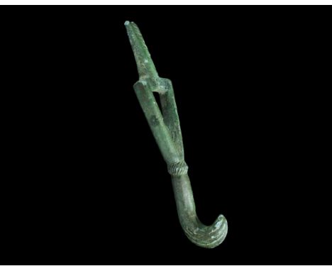 14th century AD. A bronze spanning hook for a crossbow with D-section triangular openwork panel and tang to the upper edge wi