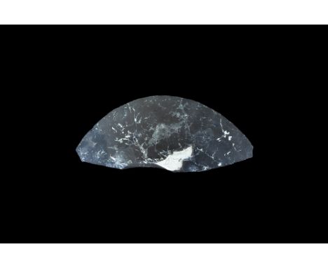 Neolithic, 6th-3rd millennium BC. A knapped and finely polished flint crescentic knife or scraper blade with chamfered edge. 