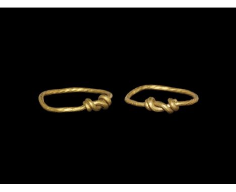 9th-11th century AD. A round-section hoop with twist detailing, the ends coiled over the shank. 1.76 grams, 19mm overall, 16.