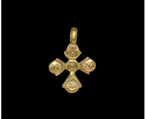 6th-9th century AD. A cruciform gold pendant with disc finial to each arm and integral loop above; central bust of Christ wit