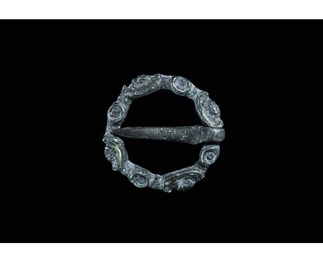 14th century AD. A silver parcel-gilt annular brooch, the hoop convex with four discoid and four crescentic plaques; flat-sec
