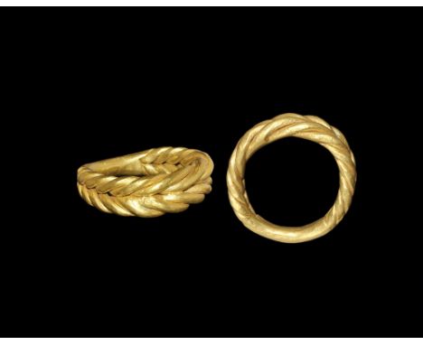 9th-11th century AD. A broad hoop formed as a herringbone braid of round-section tapering rods; hammer-welded into a single b