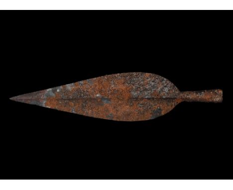2nd century BC-1st century AD. A broad iron La Tène type spearhead with raised midrib, tapering leaf-shaped blade with narrow