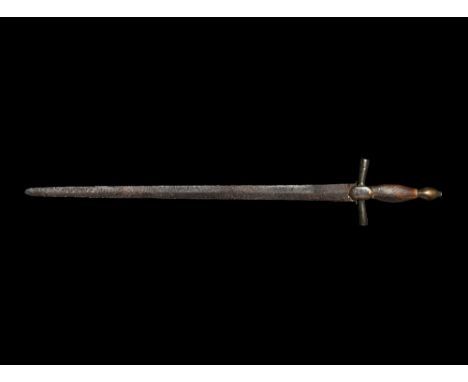 15th century AD. A slender lentoid-section blade with rounded tip, short ricasso and baluster; short oval-section quillons wi