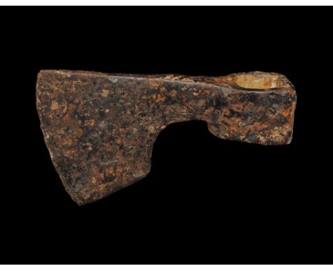 11th-13th century AD. A hand-forged iron axehead with triangular-section narrow blade widening to a broad curved edge with sq