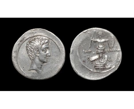 29-27 BC. Obv: bare head right within linear circle. Rev: IMP-CAESAR legend to left and right of trophy composed of helmet, c