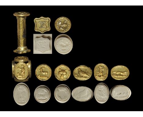 20th century AD. A group comprising: a six-sided gilt box seal matrix depicting intaglio hunting-related devices, with four o