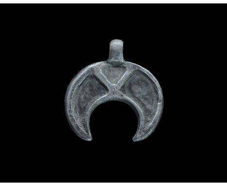 11th-13th century AD. A flat-section crescentic plaque with integral loop, the plaque divided into three cells by a chevron. 