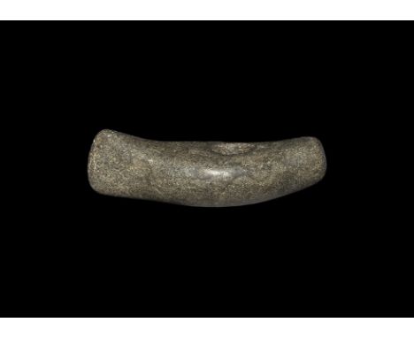 Neolithic, 4th-2nd millennium BC. A pecked and polished perforated axe of boat-shaped profile. 349 grams, 13.5cm (5 1/4"). Pr