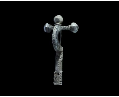 4th century AD. A fabricated silver bow brooch with pierced transverse arm, three onion-shaped knops with wire collars, beade