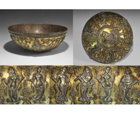 5th-7th century AD. A silver hemispherical bowl with parcel-gilt surface, with repoussé frieze of four dancing girls, a pipe-