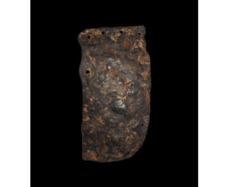 5th-8th century AD. An iron cheek-piece from the left side of a spangenhelm helmet, with slightly undulating forward edge, st