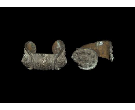 14th-16th century AD. A bronze bracelet comprising two flanged panels and hollow-formed centre; each panel with flared border
