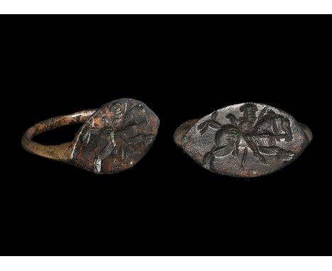 3rd-7th century AD. A keeled D-shaped hoop with scaphoid plaque, intaglio design of a galloping horseman with spear; supplied