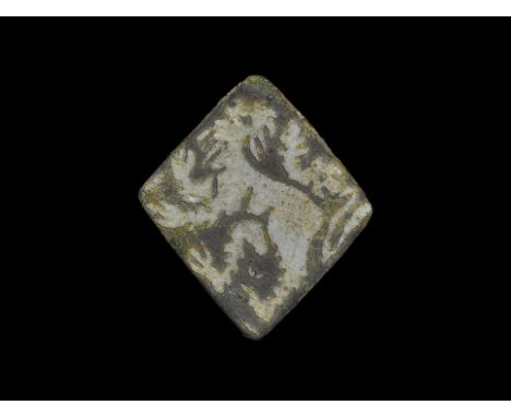 13th-15th century AD. A bronze lozenge-shaped plaque with white enamelled lion rampant regardant. 4.55 grams, 28mm (1"). Foun