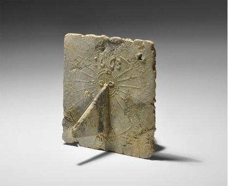 Dated 1663 AD. A pewter portable sundial, square in shape with attached triangular gnomon; the upper face of the dial plate i