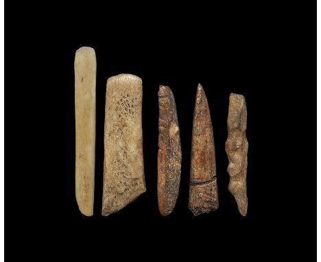 Neolithic, 5th-3rd millenium BC. A mixed group of decorated bone awls comprising: one tooth-shaped with transverse groove; on