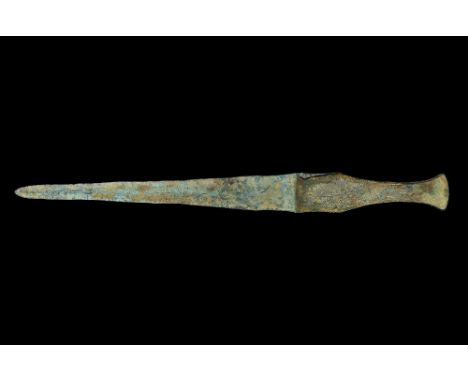 10th century BC. A Bronze Age dirk or dagger with lozenge-section narrow blade, flat-section guard, grip with flanged edges t